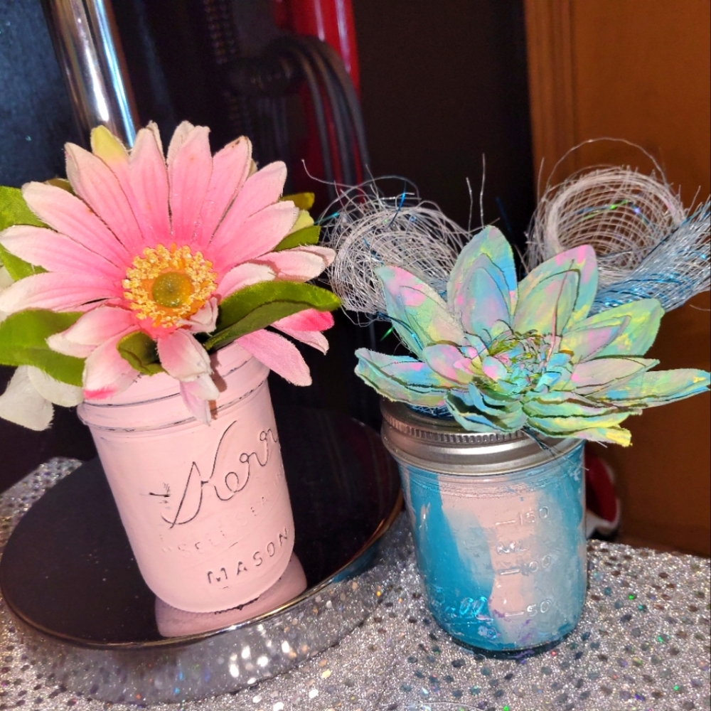 Home made mason jars, some have acrylic paint swirled inside, some chalk painted